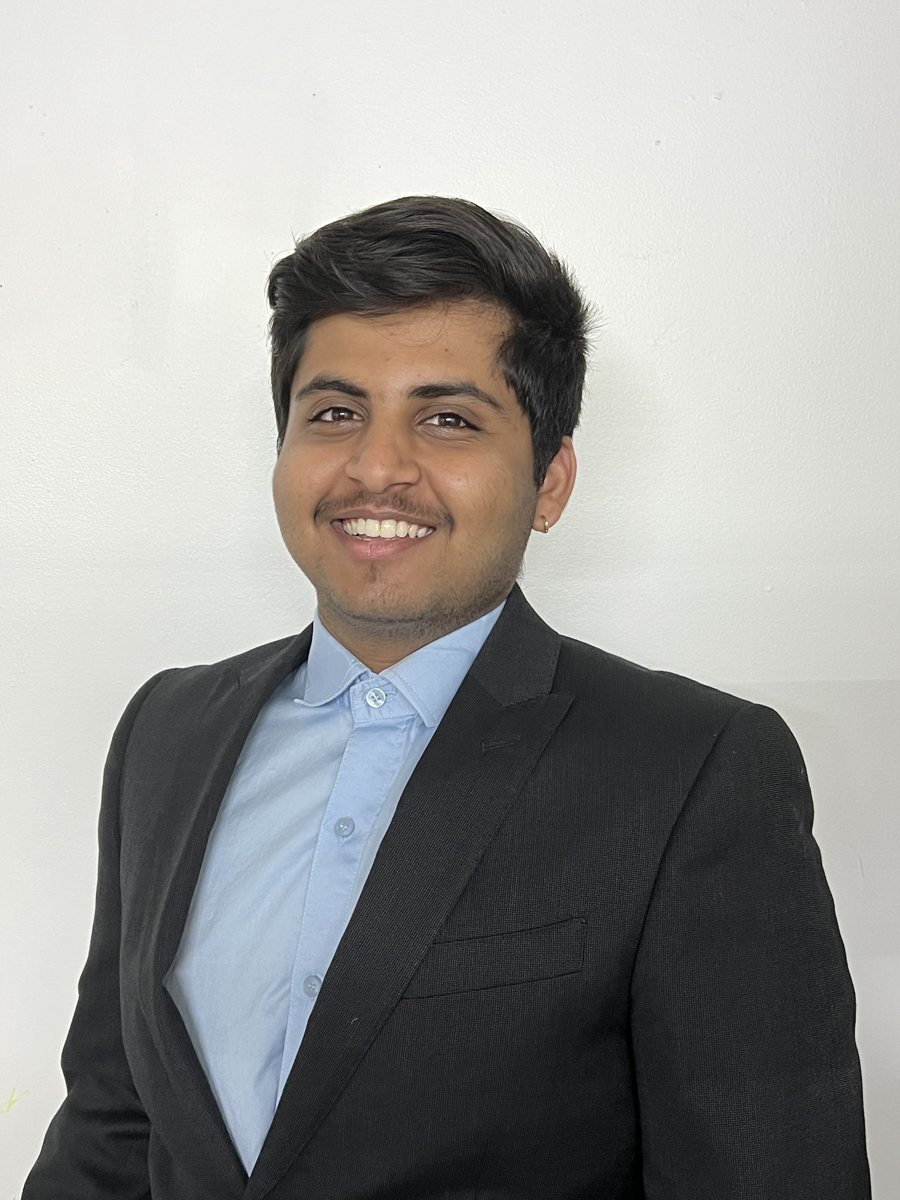 Neel Patel in a dark blazer and light blue shirt